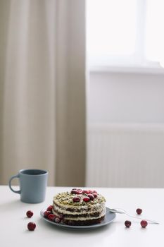  cake with spinach and cream decorated with fresh cranberries, healthy nutrition, diet breakfast