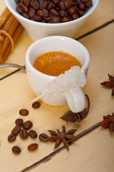 espresso coffee  over white wood rustic table  with sugar and spice