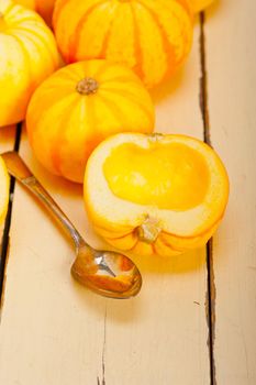 bunch of fresh yellow pumpkins just collected from garden 