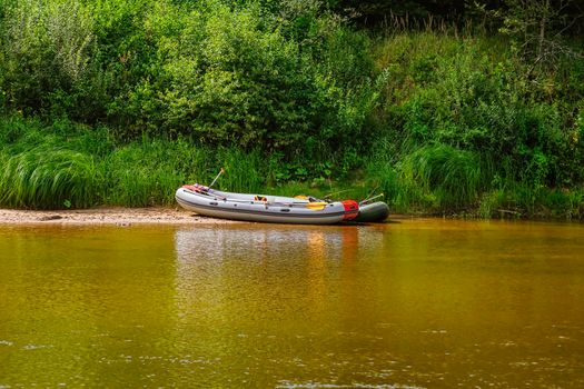 Rubber boat on the river bank 