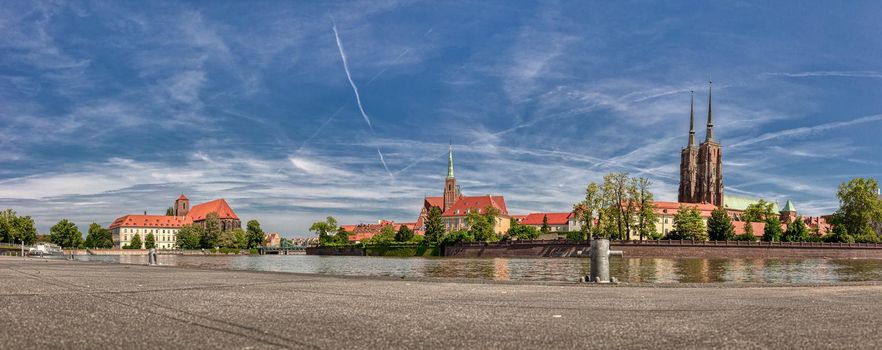 Wroclaw Old Town. Cathedral Island (Ostrow Tumski) is the oldest part of the city. Cathedral of St. John and Blessed Virgin Mary Church and Odra (Oder) river.