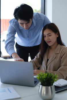 Analytics intelligence concept. Group of business people discuss current financial and economic on laptop for investment at the meeting