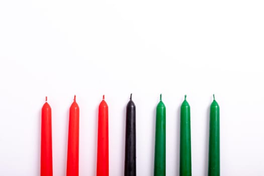 Composition of halloween candles and copy space on white background. horror, fright, halloween tradition and celebration concept digitally generated image.