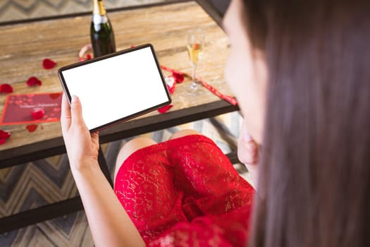 Young woman on virtual date through digital tablet with copy space. lifestyle, virtuality and telecommunications.