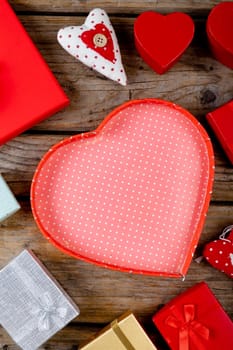 Close-up of various valentine gifts on wooden table, copy space. valentine's day and love concept.