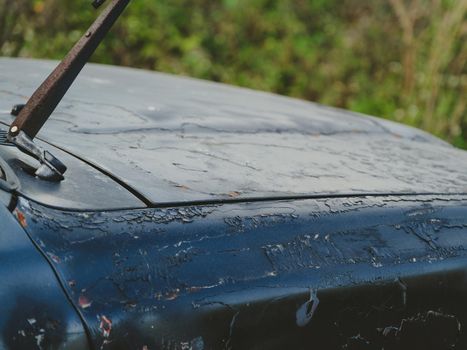 The old car skirt over time until rust. Rust on old ancient car paint rusty steel