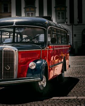 Old bus in red color, blurred background