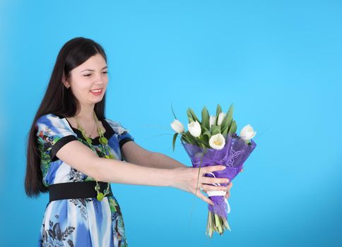 young smiling beautiful girl with the flowers