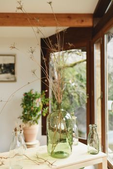 Bouquet of dried branches in a glass vase