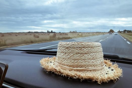 A hat in the car Rural landscape outdoor the window