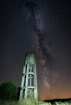 Rusty concrete water Tank under the milky way