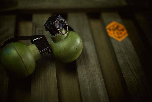 the explosive grenades on the background of a wooden weapon box