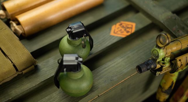 the explosive grenades on the background of a wooden weapon box