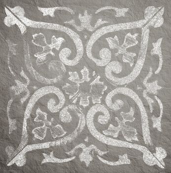 Geometric decorative designs on a rough paper background.
