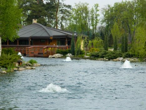 Mezhyhirya National Park, Novi Petrivtsi, Kyiv region, Ukraine: Museum of Corruption. The large natural complex Mezhyhirya Residence with a beautiful garden, a cascade of lakes. High quality photo