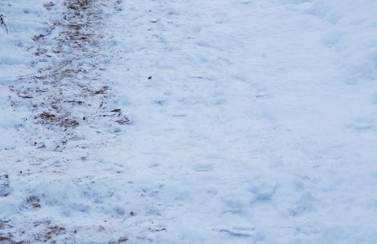 Stairs in the snow. Footprints in the snow.