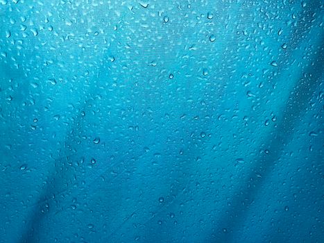 Drops down on the blue canvas floor. Abstract background