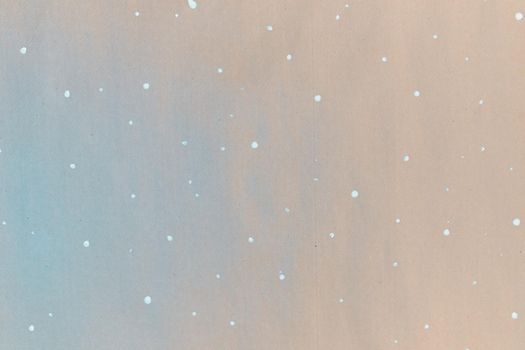 Texture of gift wrapping paper. Abstract drawing on craft paper for surprises. White dots in the form of snowflakes. The concept of Christmas and the New year.