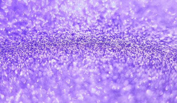 Beautiful violet decorative abstract blurred shining background. Copy space