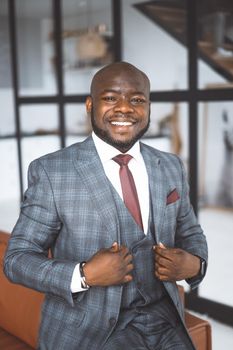 Successful Young Businessman. African American Guy In Stylish Expensive Suit Folded His Palms Together Looking Directly Into Camera. Concept Of Victory, Personal Growth. High quality photo