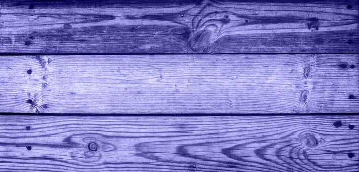 Lilac background - an old dark wood texture, with a horizontal pattern of wood. Copy space. Banner