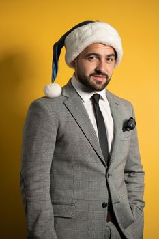 Concept of business and Christmas holidays. Man bearded hipster wear formal suit and Santa hat. High quality photo