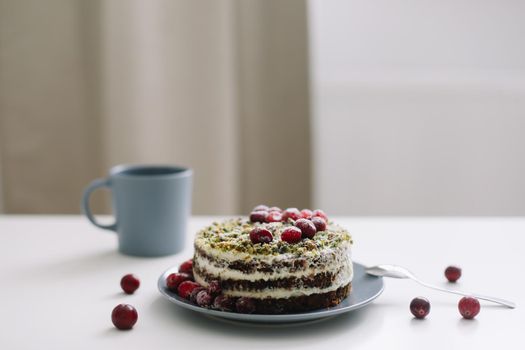  cake with spinach and cream decorated with fresh cranberries, healthy nutrition, diet breakfast