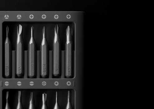 Screwdriver tips different shapes and sizes close up. Manual metal mini screwdriver and set of the interchangeable bits. Precision Screwdriver Kit. Steel Magnetic Bits. home appliance repair kit.