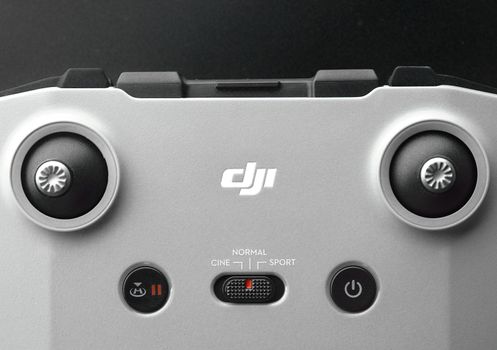 DJI remote control on black background. Control stick of the DJI Mavic 3 drone. Unpacking and configuring the DJI copter. 17.12.2021, Rostov region, Russia.