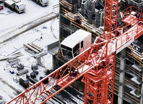 Construction Crane from Above. tower crane on the construction site aerial view. Aerial View Of construction site with crane. Construction workers are building. Top view.