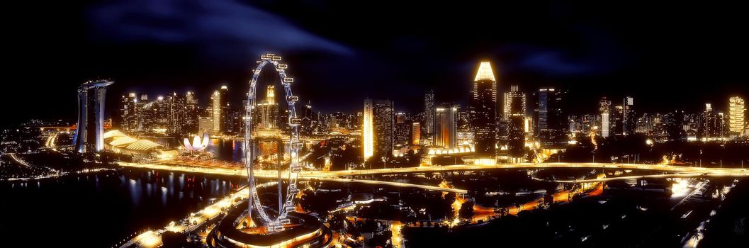 Beautiful mystical view of Singapore night. Skyscrapers at the Marina Bay. Panorama of the sights of Singapore.