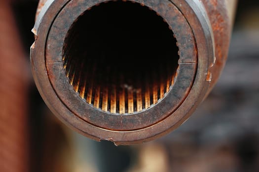 A big gun. The rifled gun of the tank. Close-up of a tank gun barrel with rifling. Abstract background of the armed conflict.