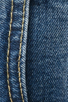 Seams on jeans close-up. Stitching on denim. Close up of blue jeans background. Denim texture.