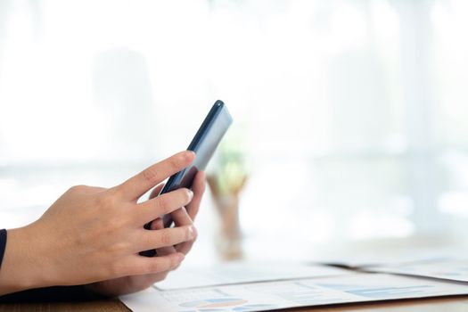 Young man using mobile phone. Using online connect technology for business, education and communication.