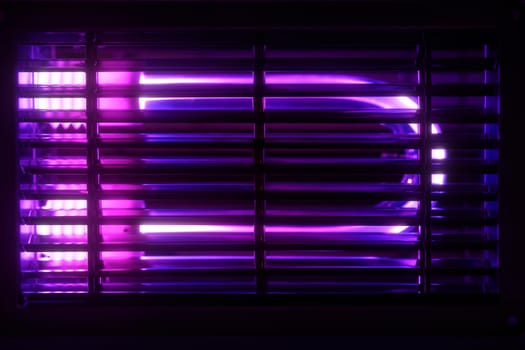 Ultraviolet lamp for disinfection and sanitation. UV lamp for air disinfection. UV disinfection. Concept of cleanliness and hygiene, lamp's blue light kills bacteria and viruses.