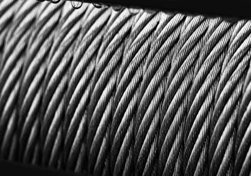 Metal cable winch. Steel rope winch close-up. Strong still background.