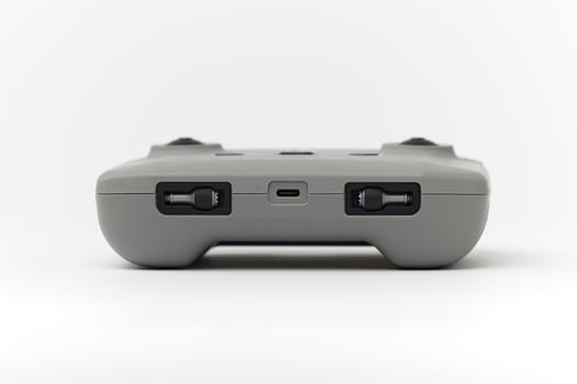 DJI remote control on white background. Control stick of the DJI Mavic 3 drone. Unpacking and configuring the DJI copter. 17.12.2021, Rostov region, Russia.