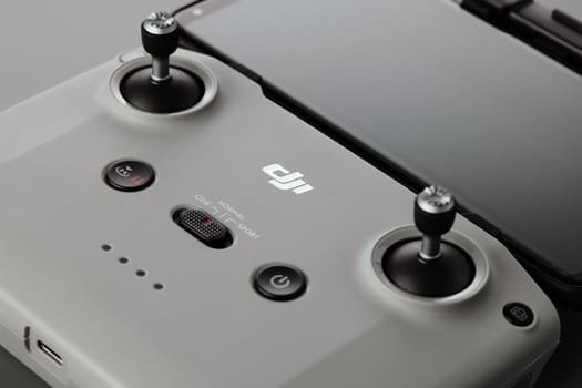 DJI remote control. Control stick of the DJI Mavic 3 drone remote control with mobile phone attached. Unpacking and configuring the DJI copter. 17.12.2021, Rostov region, Russia.