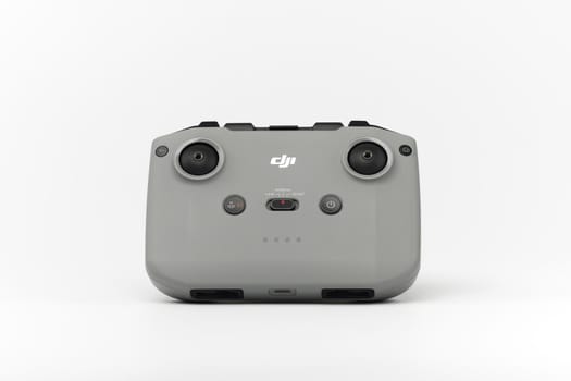 DJI remote control on white background. Control stick of the DJI Mavic 3 drone. Unpacking and configuring the DJI copter. 17.12.2021, Rostov region, Russia.