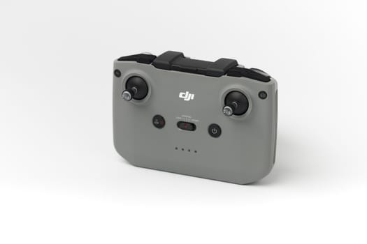 DJI remote control on white background. Control stick of the DJI Mavic 3 drone. Unpacking and configuring the DJI copter. 17.12.2021, Rostov region, Russia.