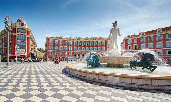 France, Nice, Fountain of the Sun, Place Massena in center of Nice, Plassa Carlou Aubert, tourism, sunny day, blue sky, square tiles laid out in a checkerboard pattern, Apollo statue. High quality photo