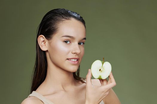 brunette apple in hands posing fruit healthy food fresh isolated background. High quality photo