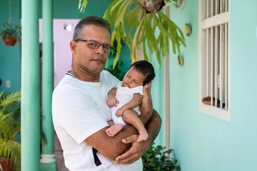 Photo of a baby in the arms of a man