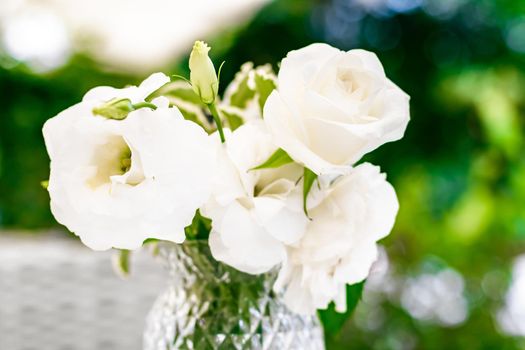 Wedding decoration, table decor and floral beauty, bouquet of white roses in luxury restaurant, beautiful flowers from summer garden.