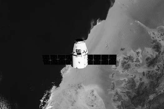 The SpaceX Dragon resupply ship is pictured approaching the Space Station. Elements of this image furnished by NASA.
