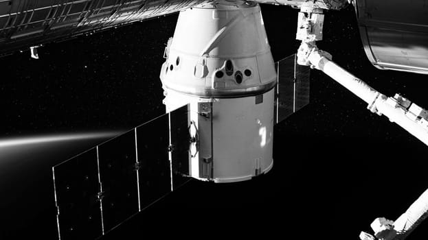 SpaceX Crew Dragon spacecraft is docked to the Space Station. Elements of this image furnished by NASA.