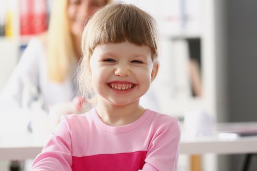 Portrait of little happy child at pediatrician cabinet, planned appointment for kid. Healthy lifestyle, hospital, help, checkup, medicine, health concept