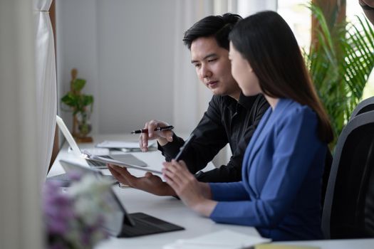 Business People Talking Discussing with coworker planning analyzing financial document data charts and graphs in Meeting and successful teamwork Concept.