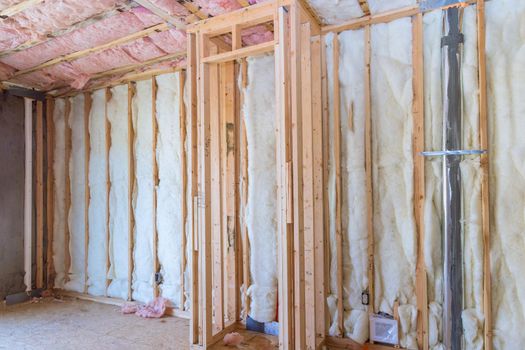 Wooden frame walls with insulated rock wool fiberglass insulation for cold barrier with comfortable warm home construction renovation