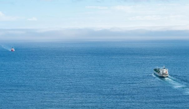 Passing freighters in the sea